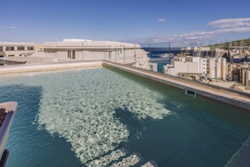 a pool with a building in the background