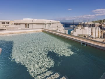 a pool with a building in the background
