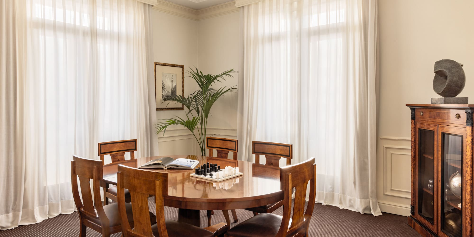 a room with a table and chairs