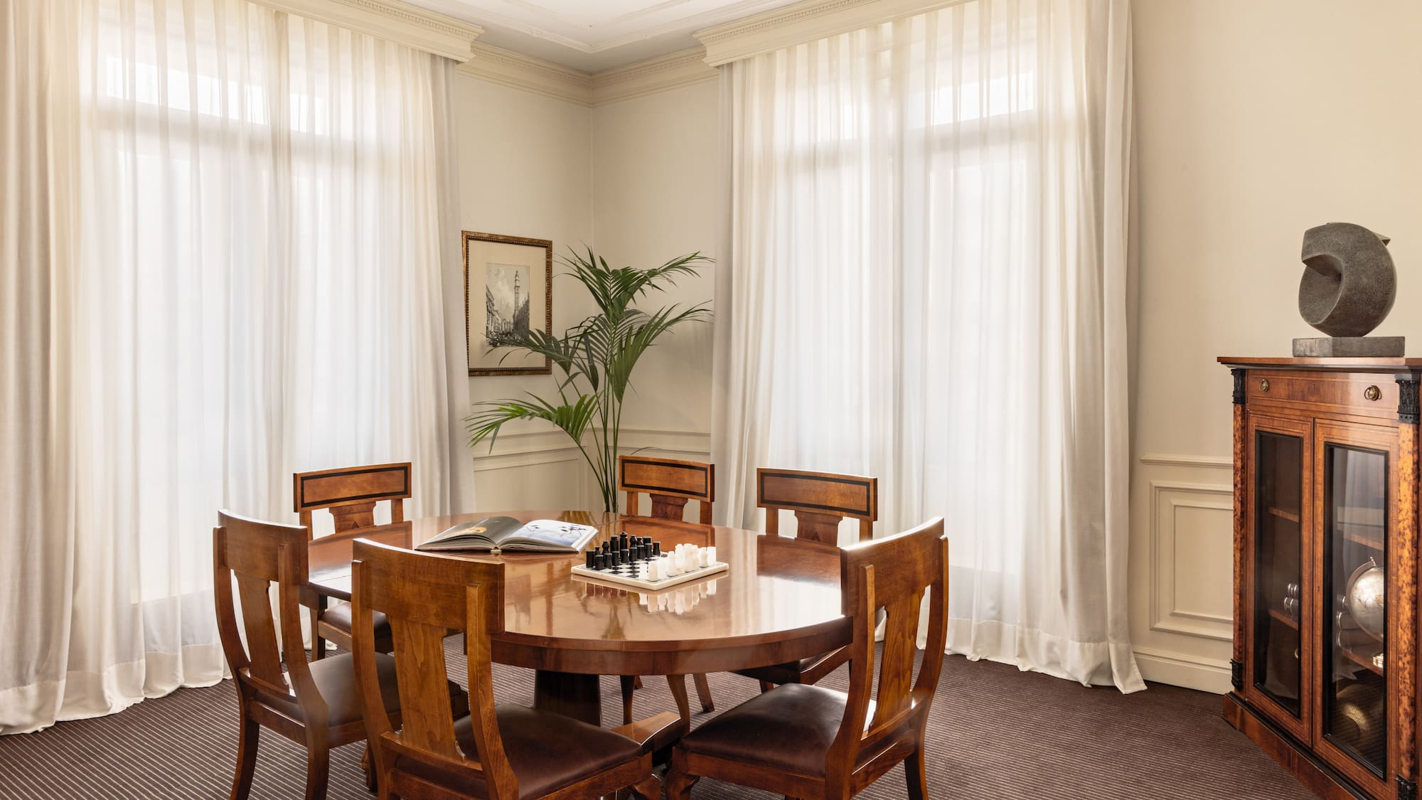 a room with a table and chairs