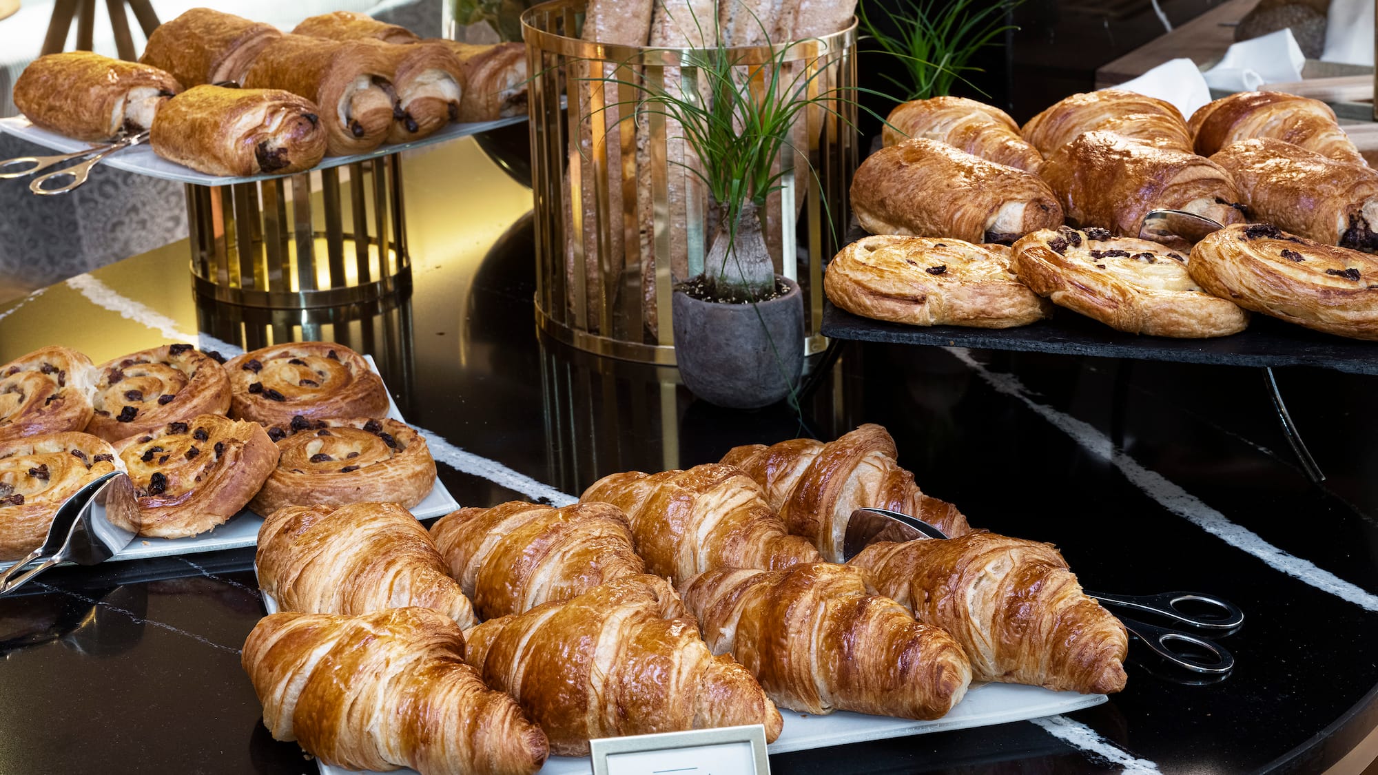 a table with pastries and bread