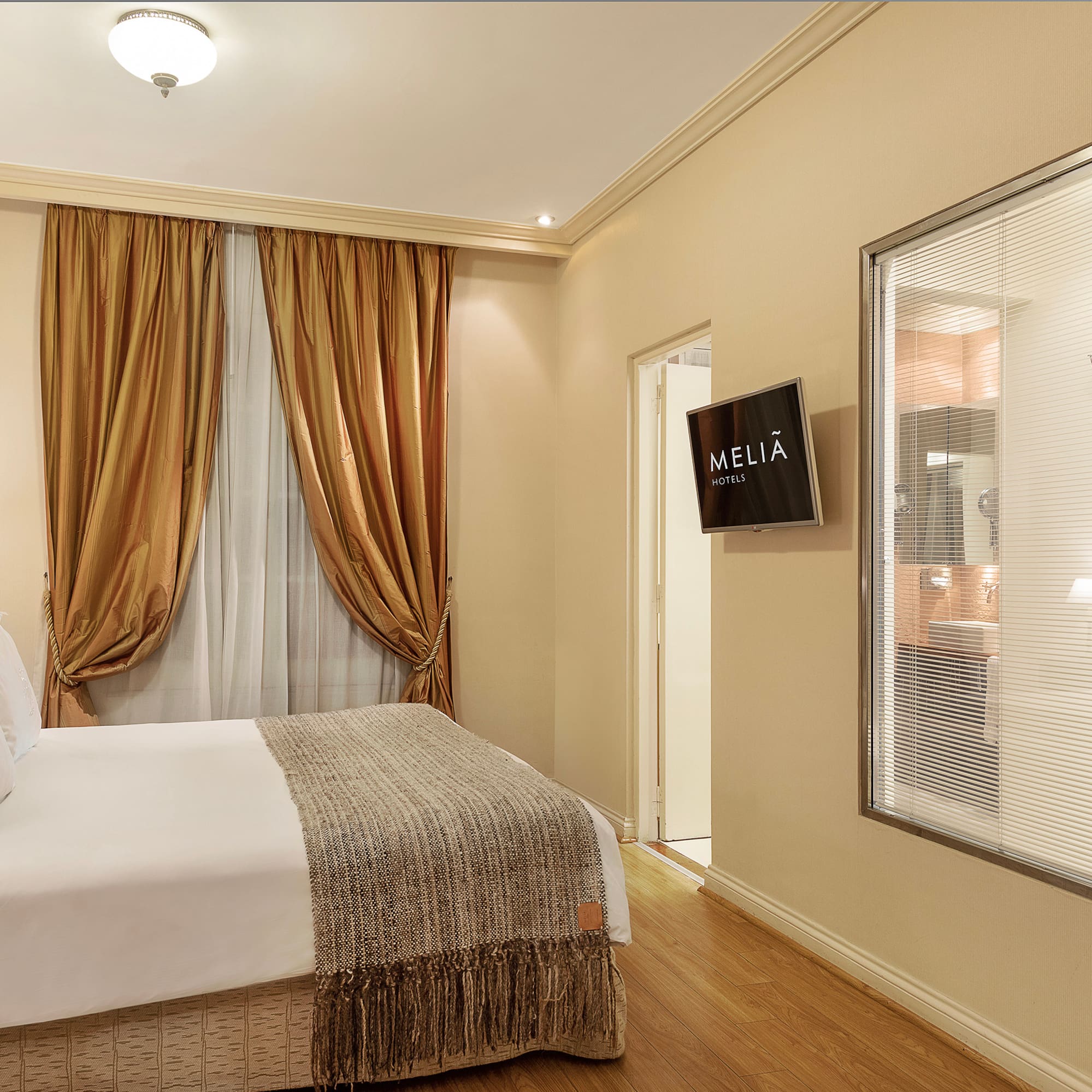 a room with a bed and a screen