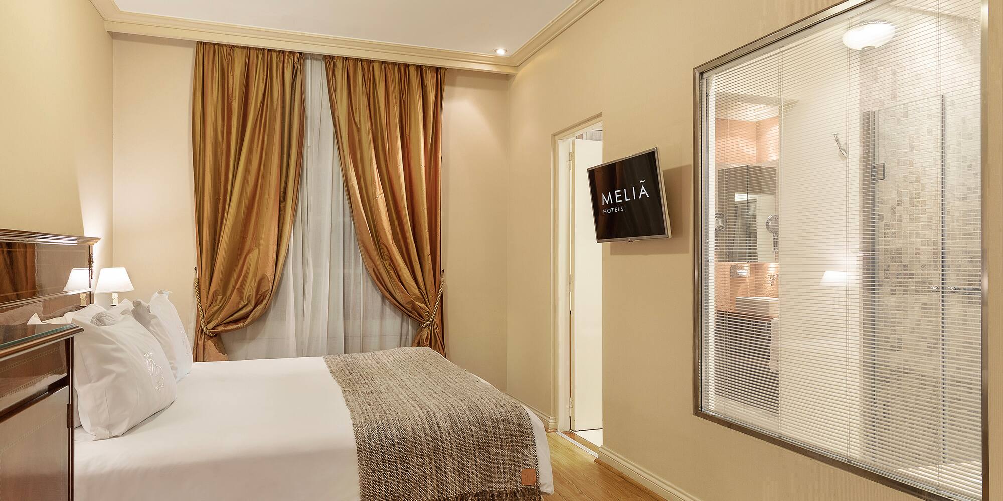 a room with a bed and a screen