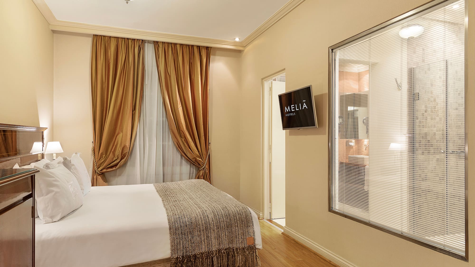 a room with a bed and a screen