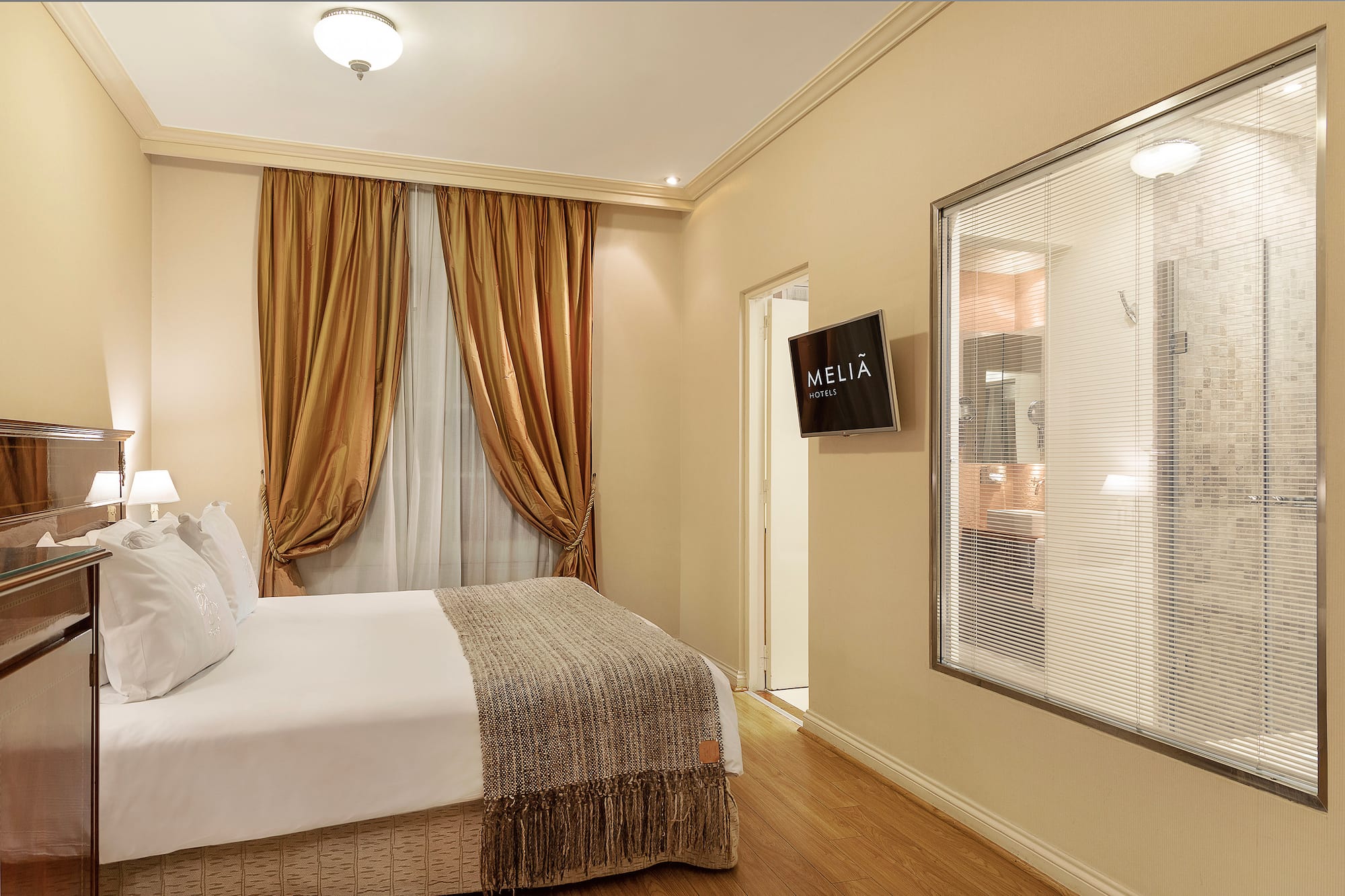 a room with a bed and a screen