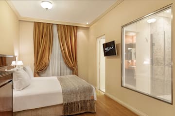 a room with a bed and a screen