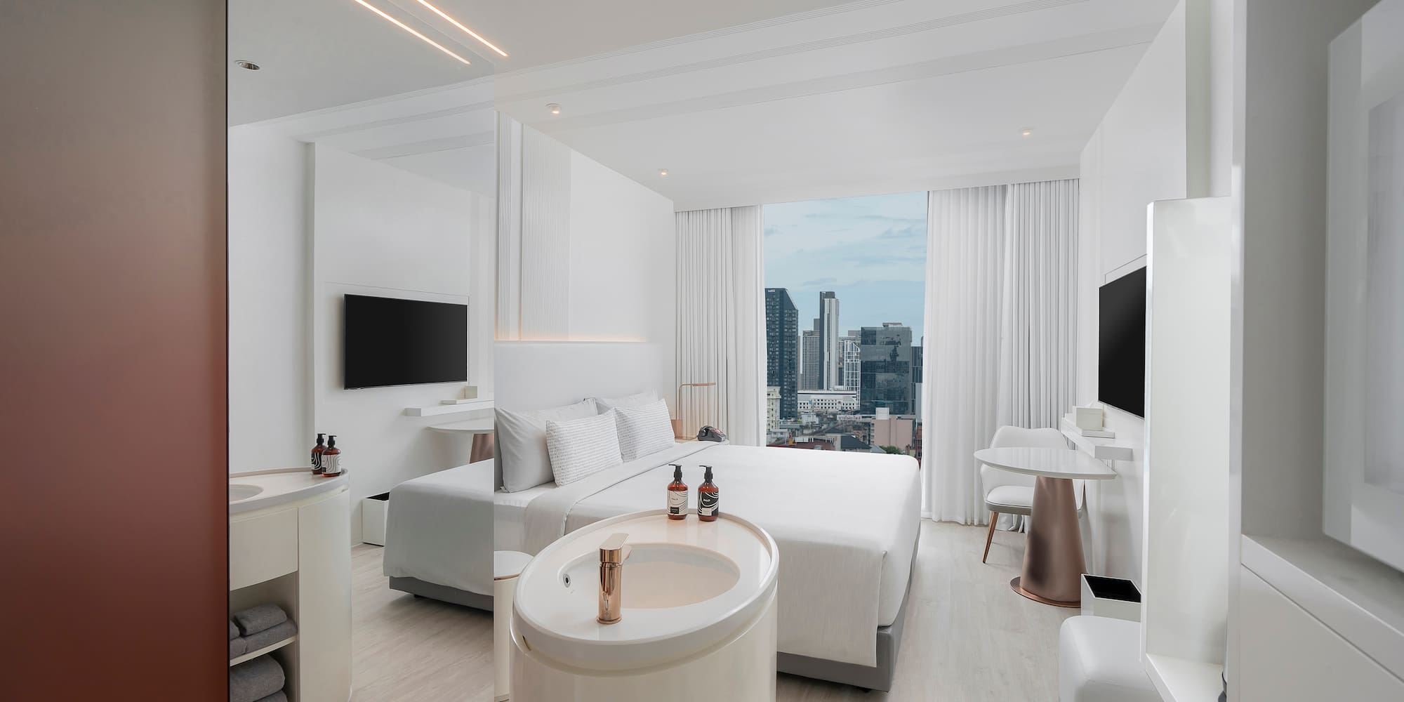 a room with a large window and a large bed