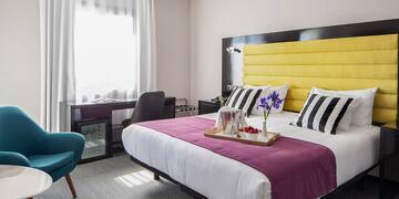 a room with a bed and a chair