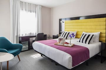 a room with a bed and a chair