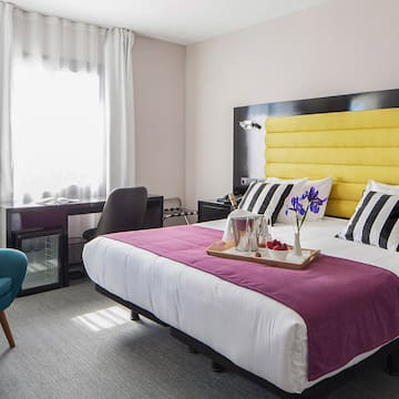 a room with a bed and a chair