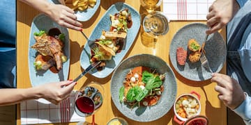 a group of people eating food on a table
