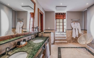 a bathroom with a large mirror and two sinks