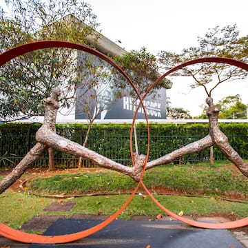 a sculpture of a tree with a couple of rings