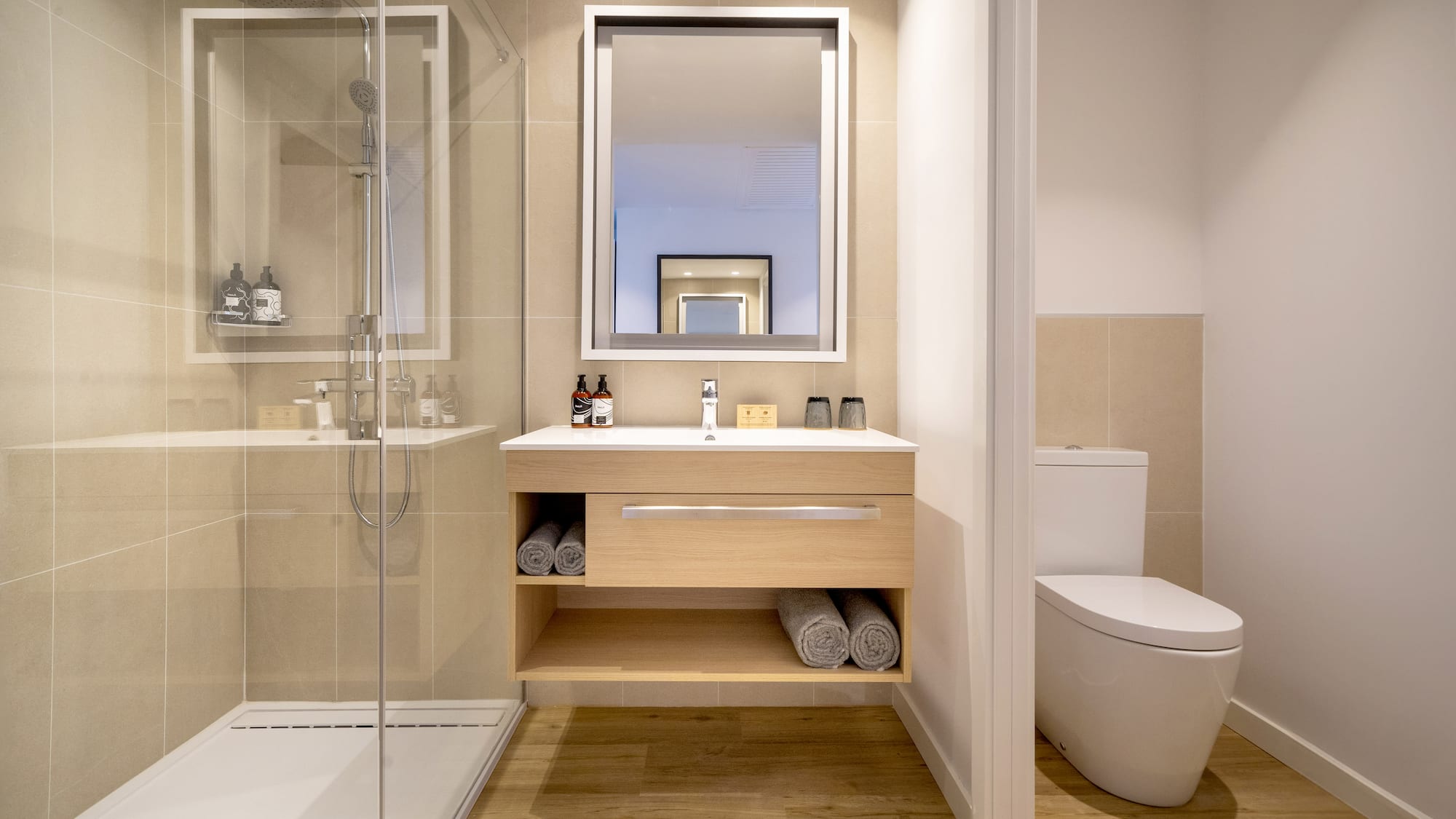 a bathroom with a mirror and a toilet