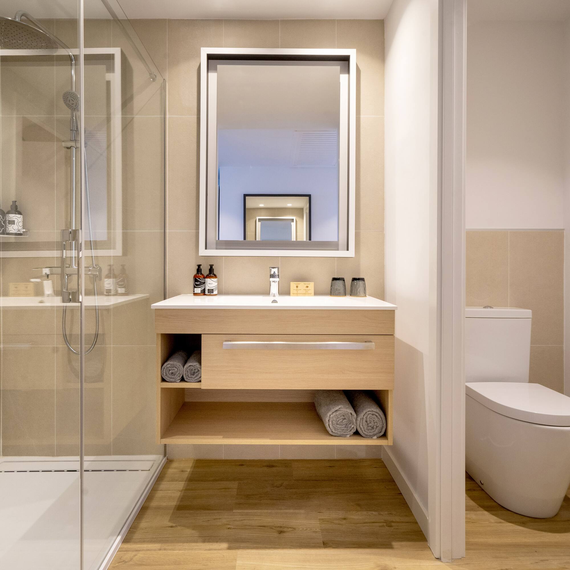 a bathroom with a mirror and a toilet