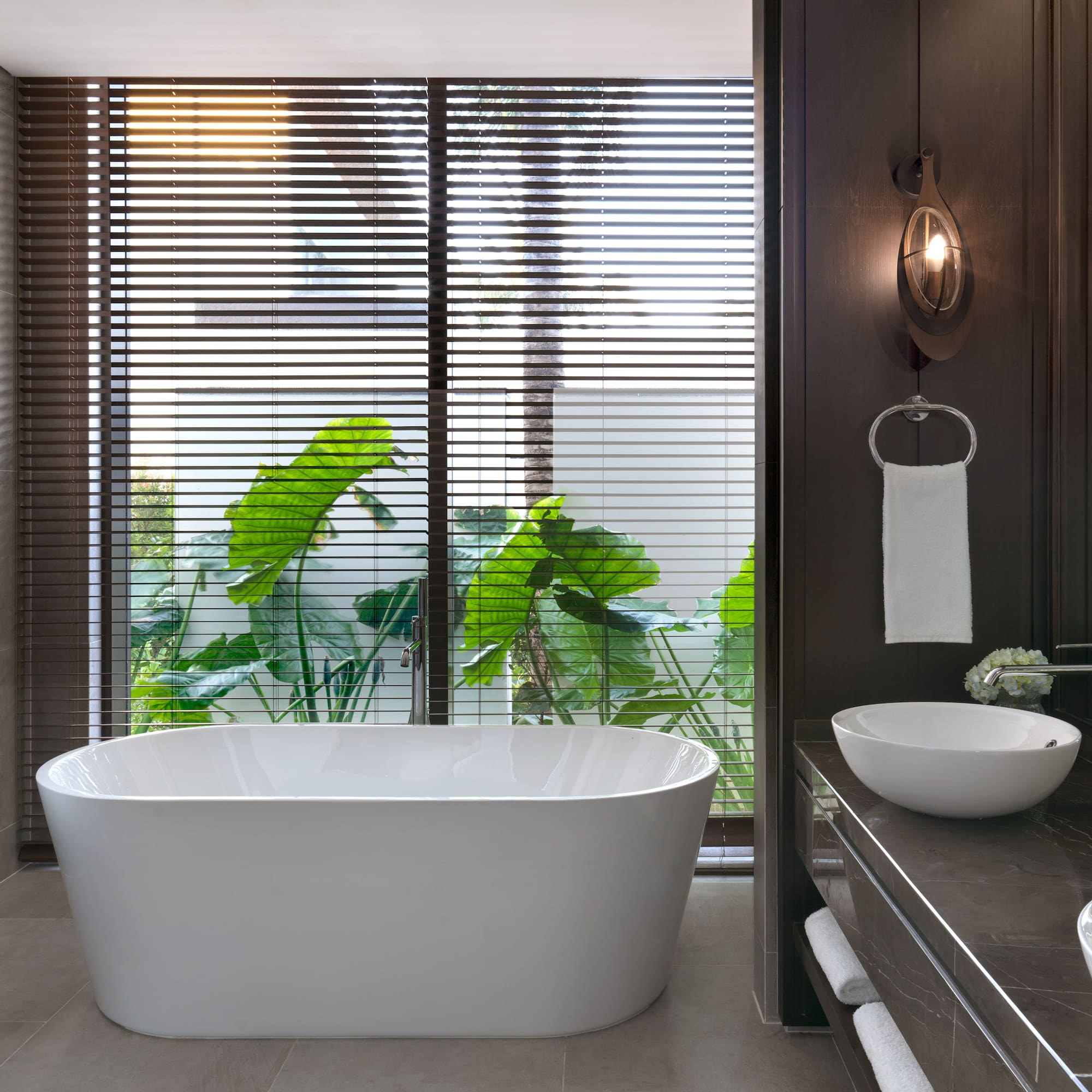 a bathroom with a tub and sink