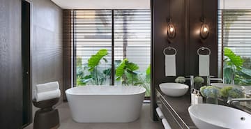 a bathroom with a tub and sink