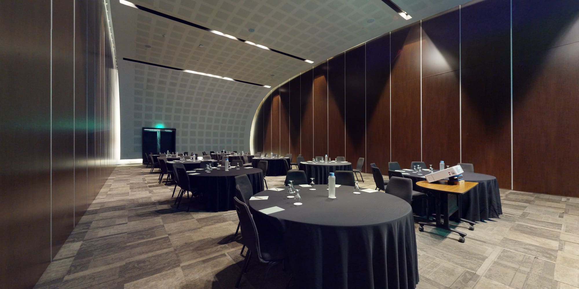 a room with round tables and chairs