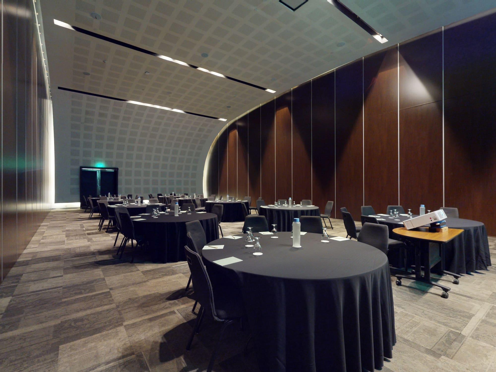 a room with round tables and chairs