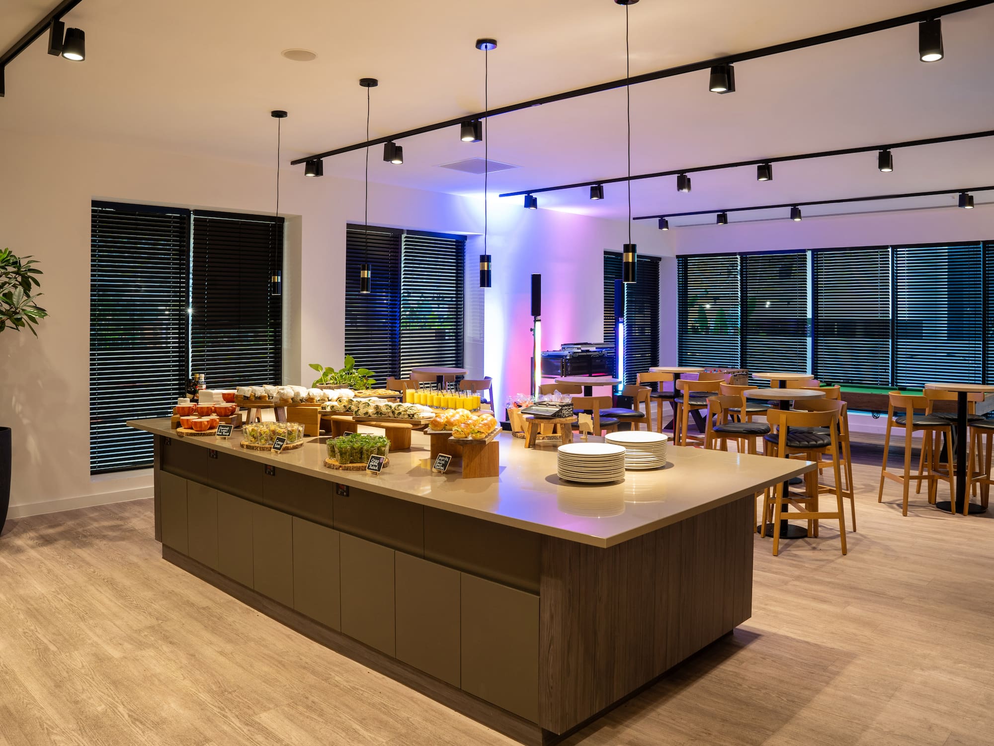 a large kitchen with a table of food