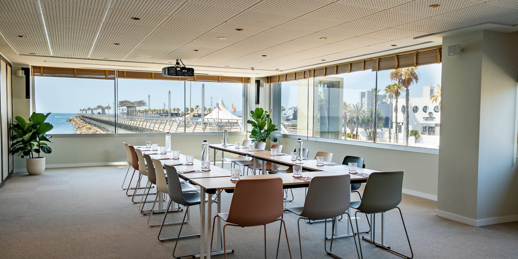 a room with a long table and chairs