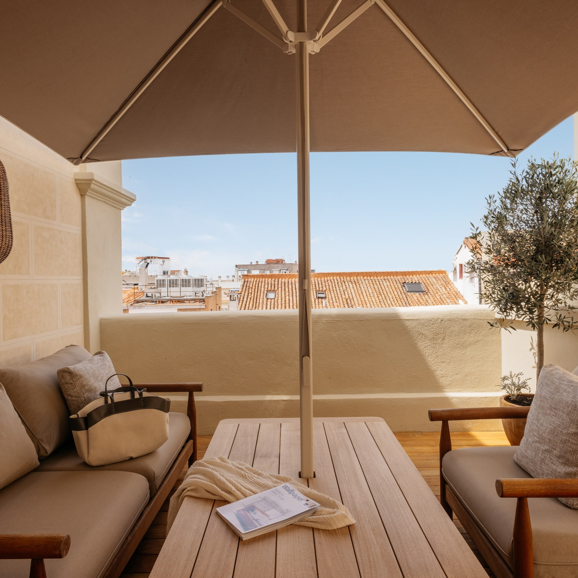 a patio with a table and chairs