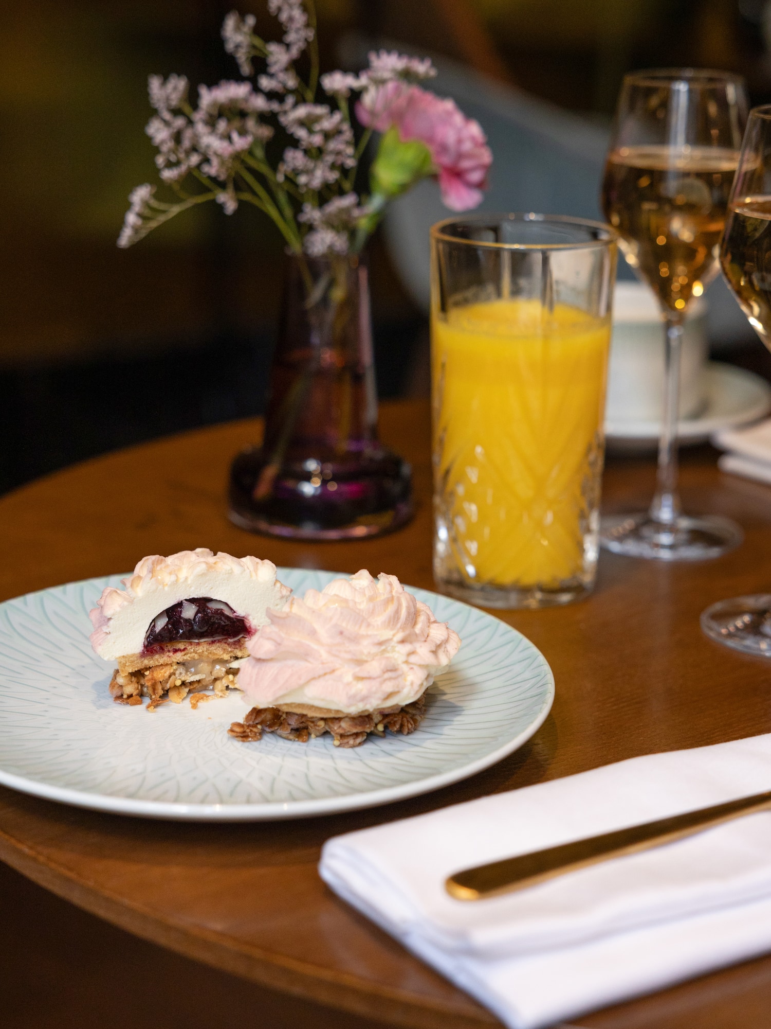 a plate of dessert and glasses of juice