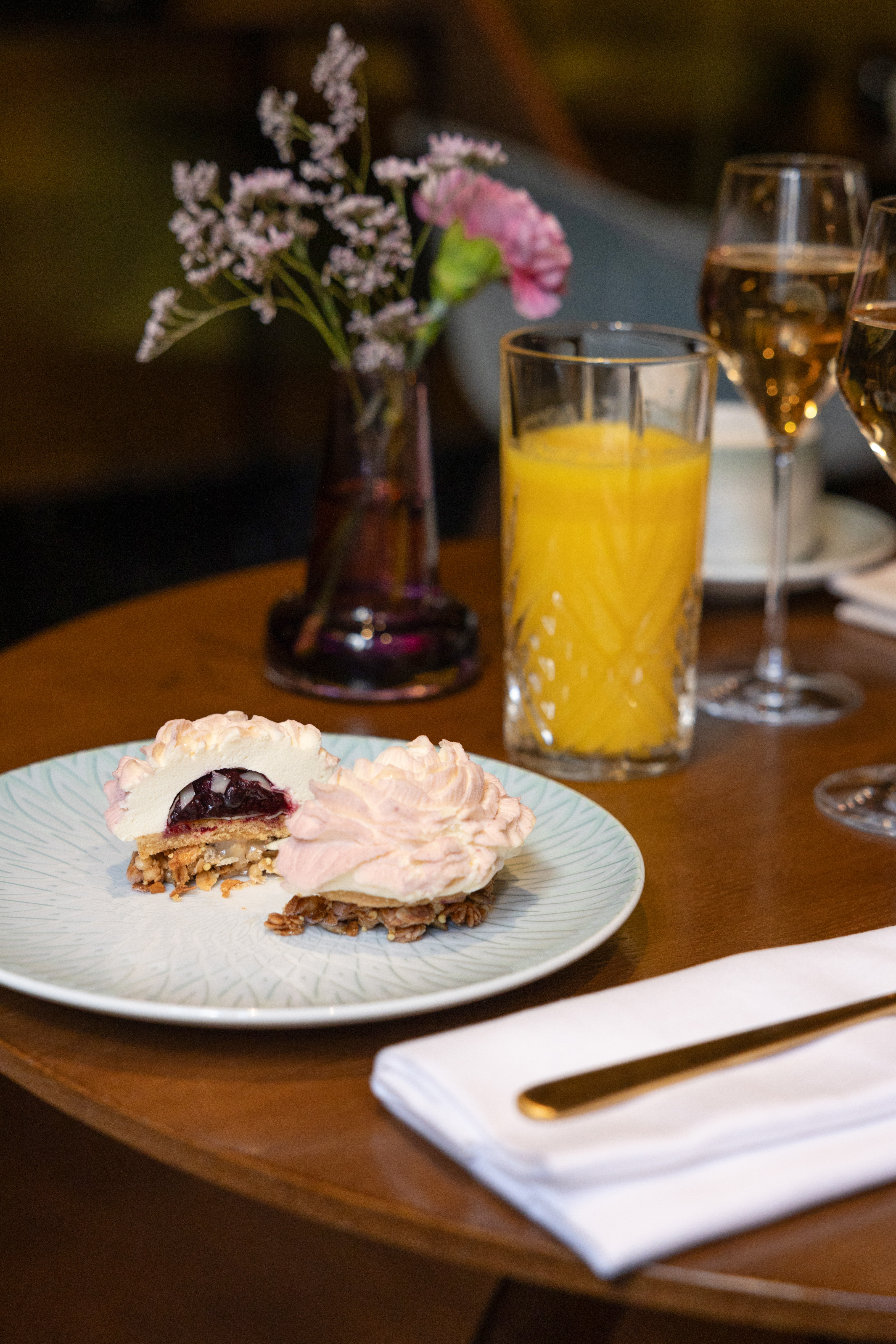 a plate of dessert and glasses of juice