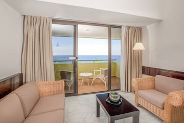 a living room with a glass door and a couch