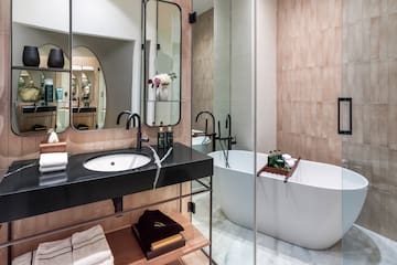 a bathroom with a tub and sink