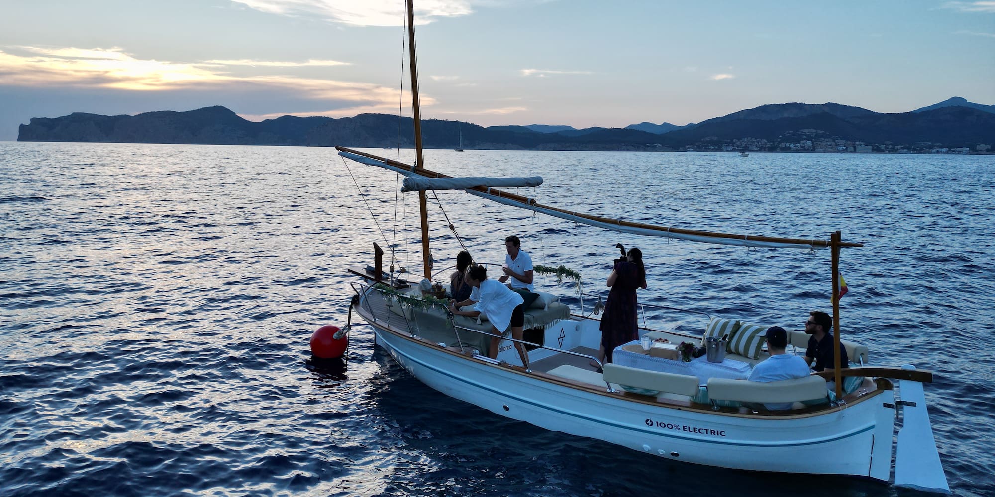 a group of people on a boat in the water