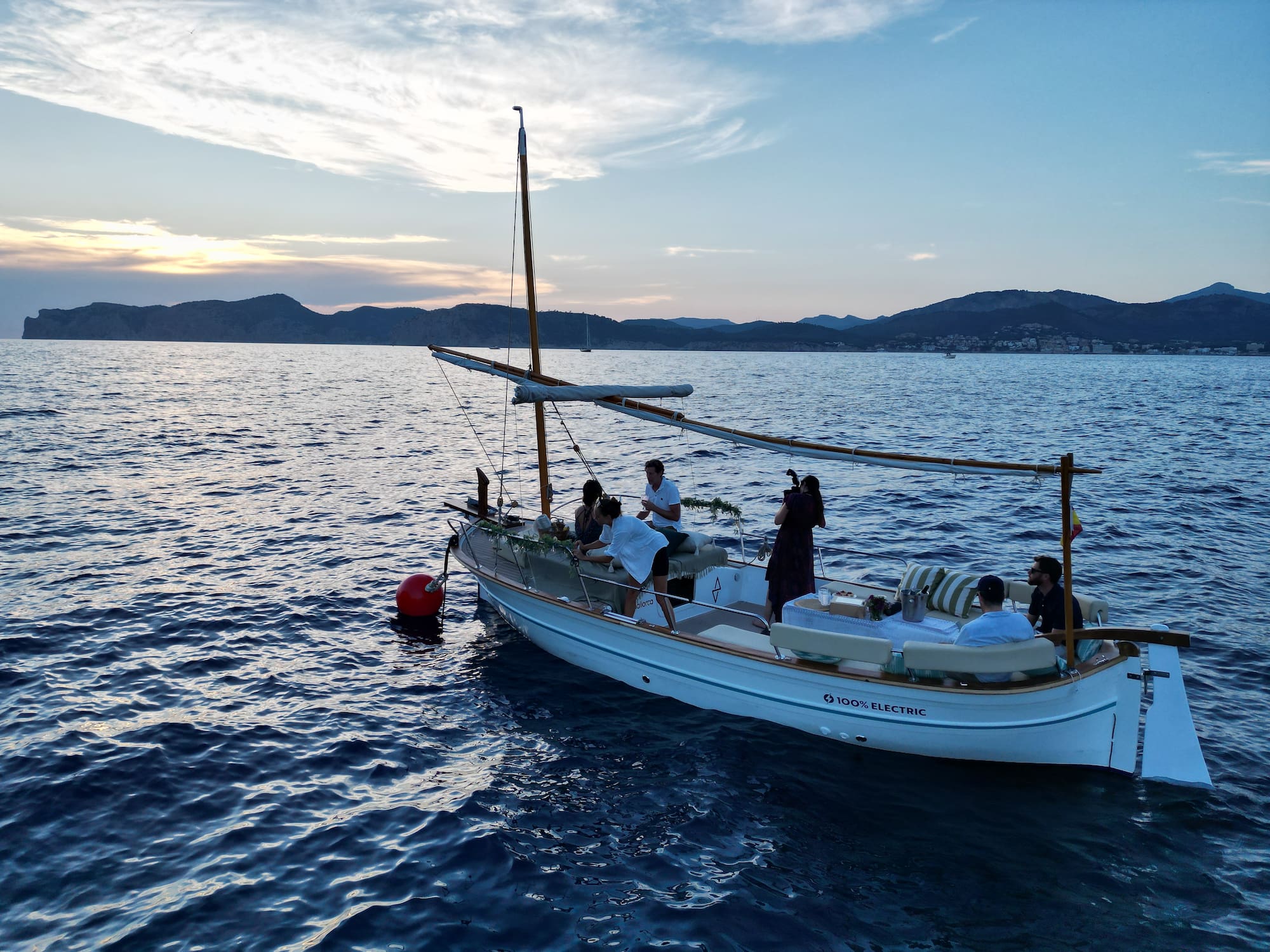 a group of people on a boat in the water