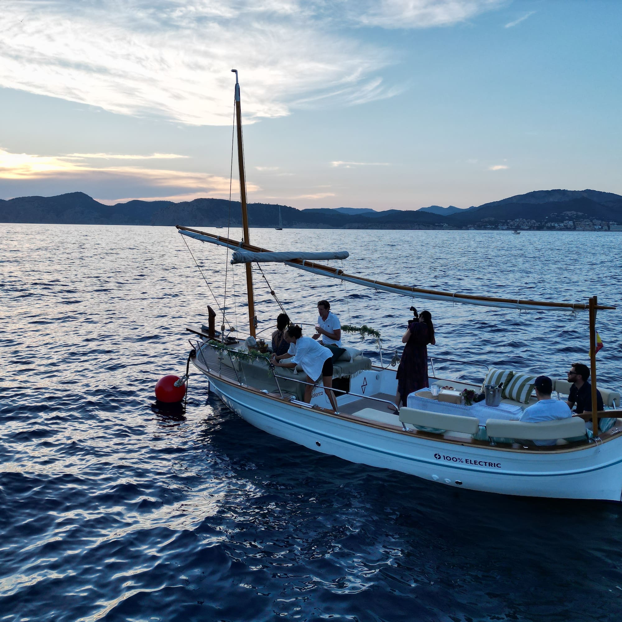 a group of people on a boat in the water