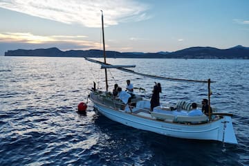 a group of people on a boat in the water