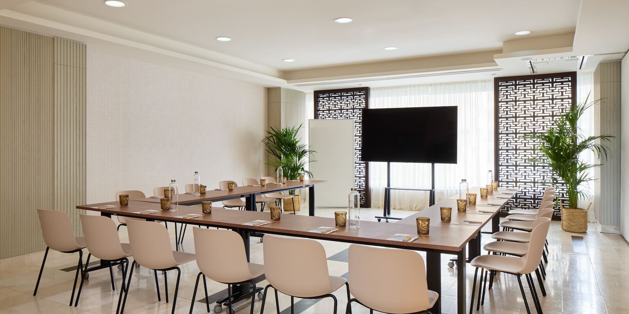 a room with a large table and chairs