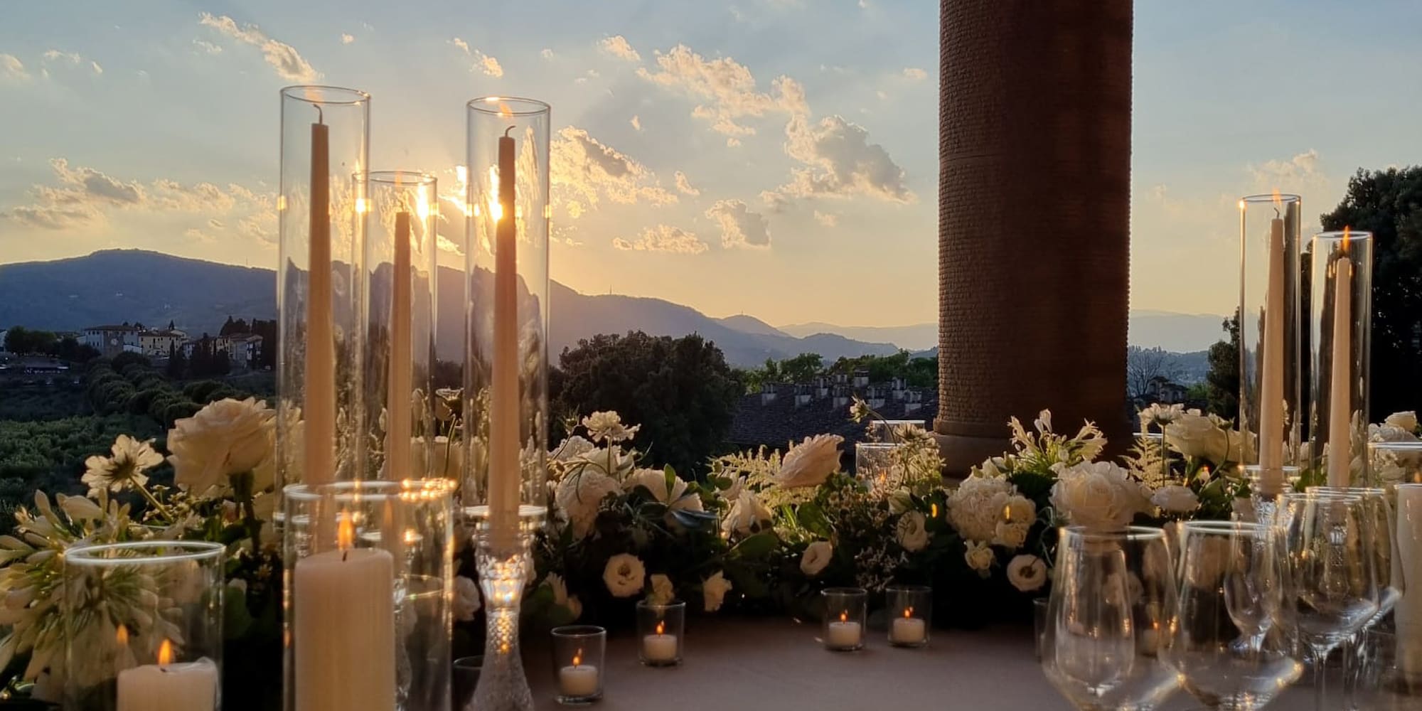 a table set with candles and flowers