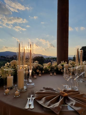 a table set with candles and flowers