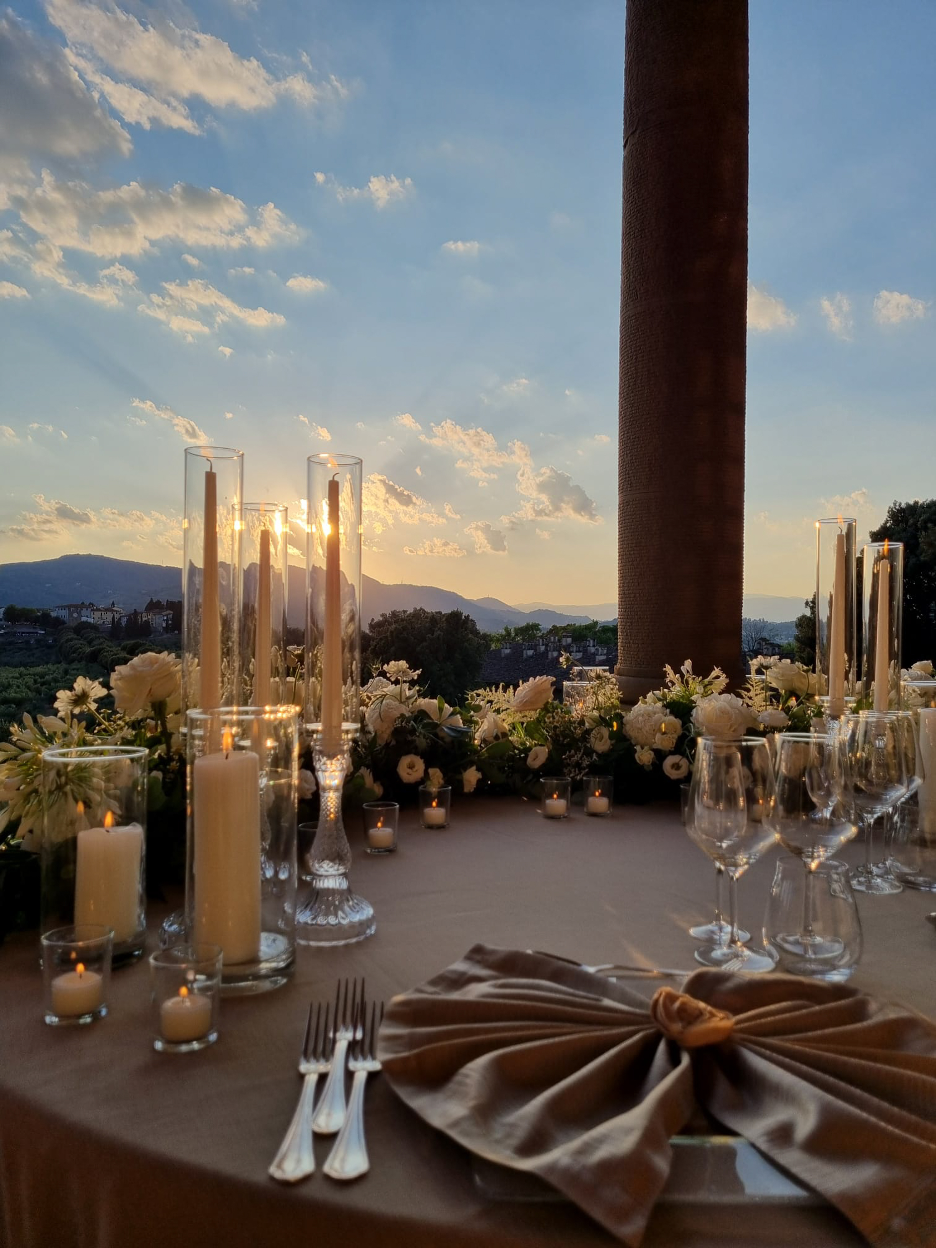 a table set with candles and flowers