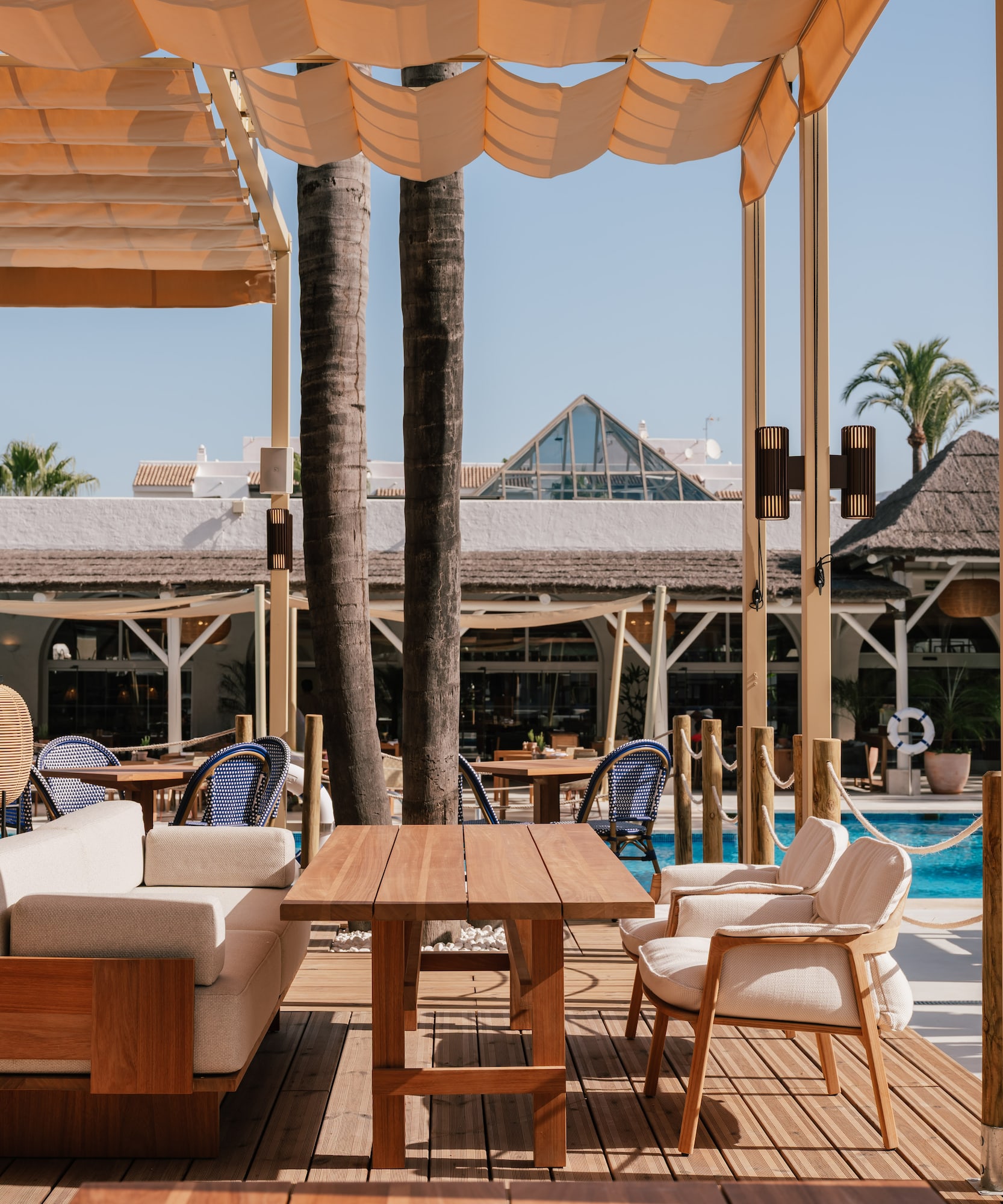 a patio with a table and chairs