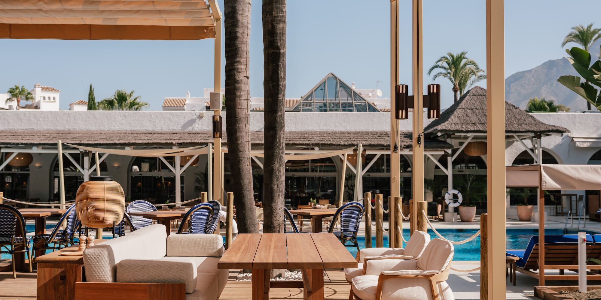 a patio with a table and chairs
