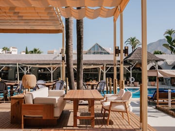 a patio with a table and chairs
