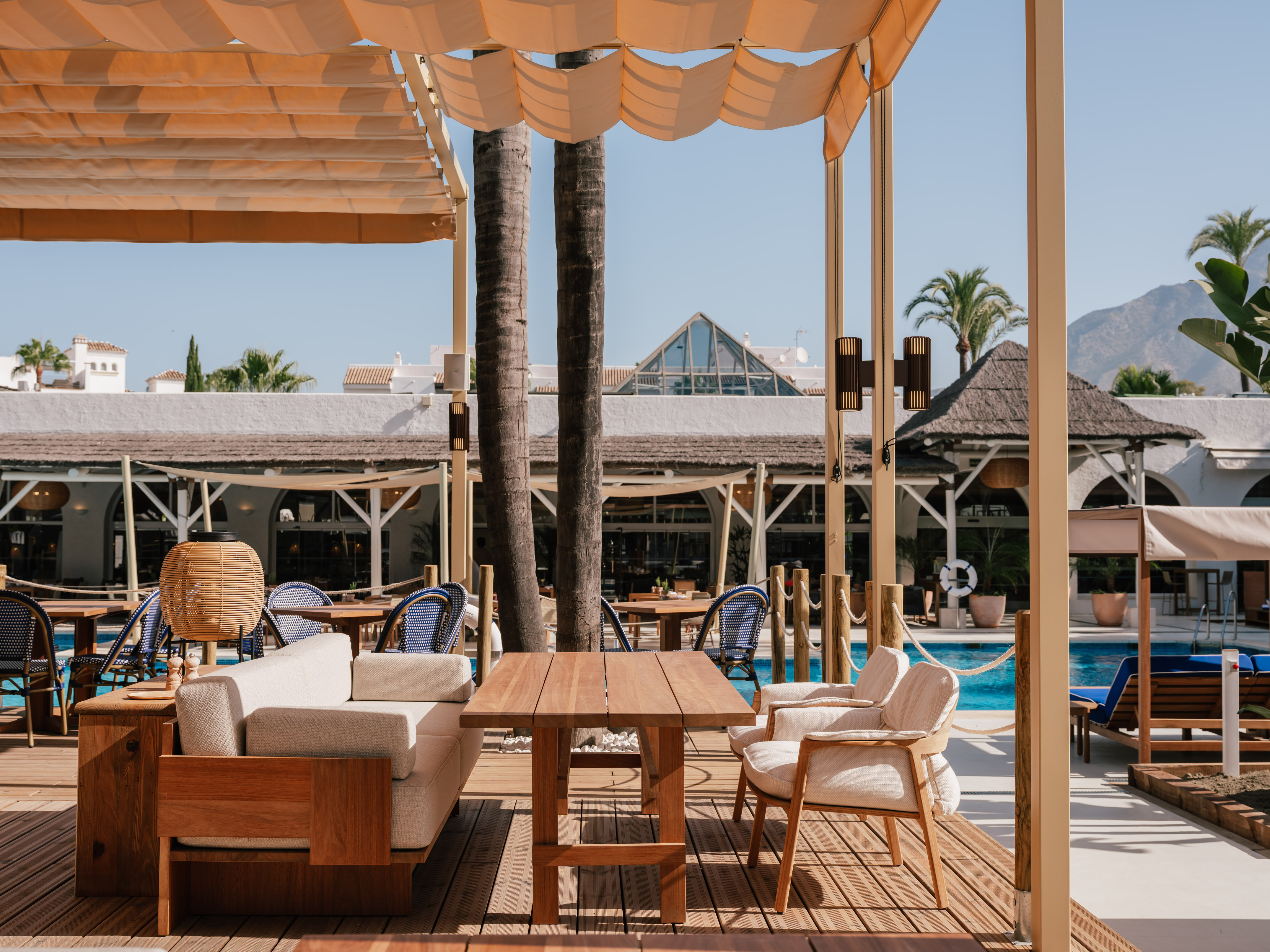 a patio with a table and chairs
