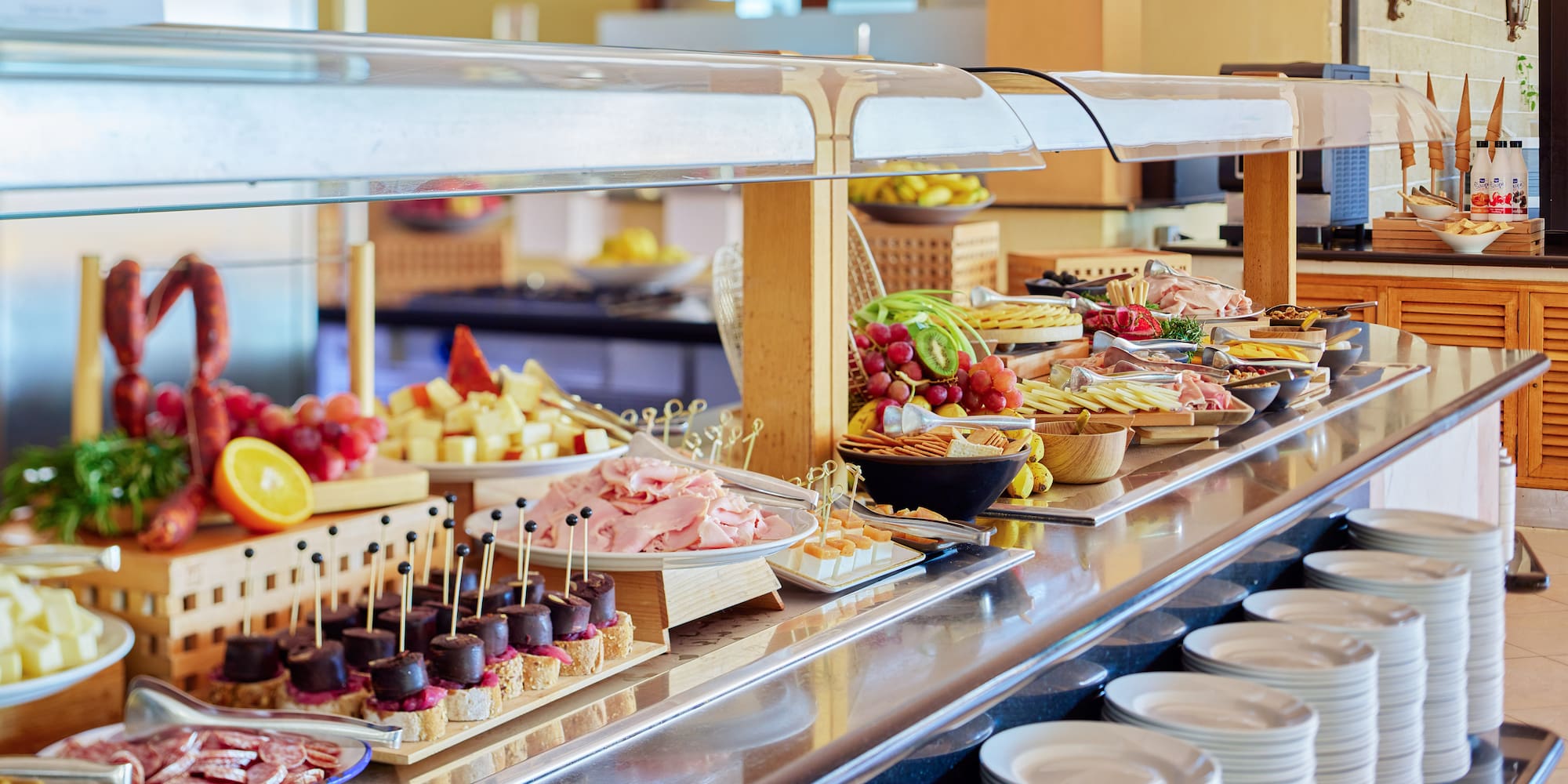 a buffet with plates of food