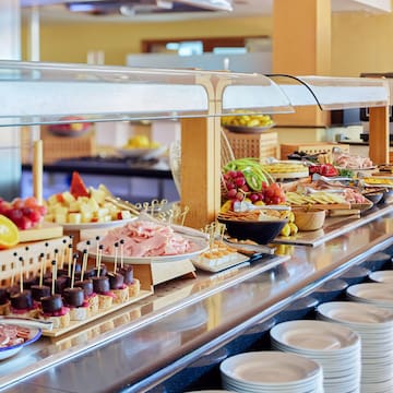 a buffet with plates of food
