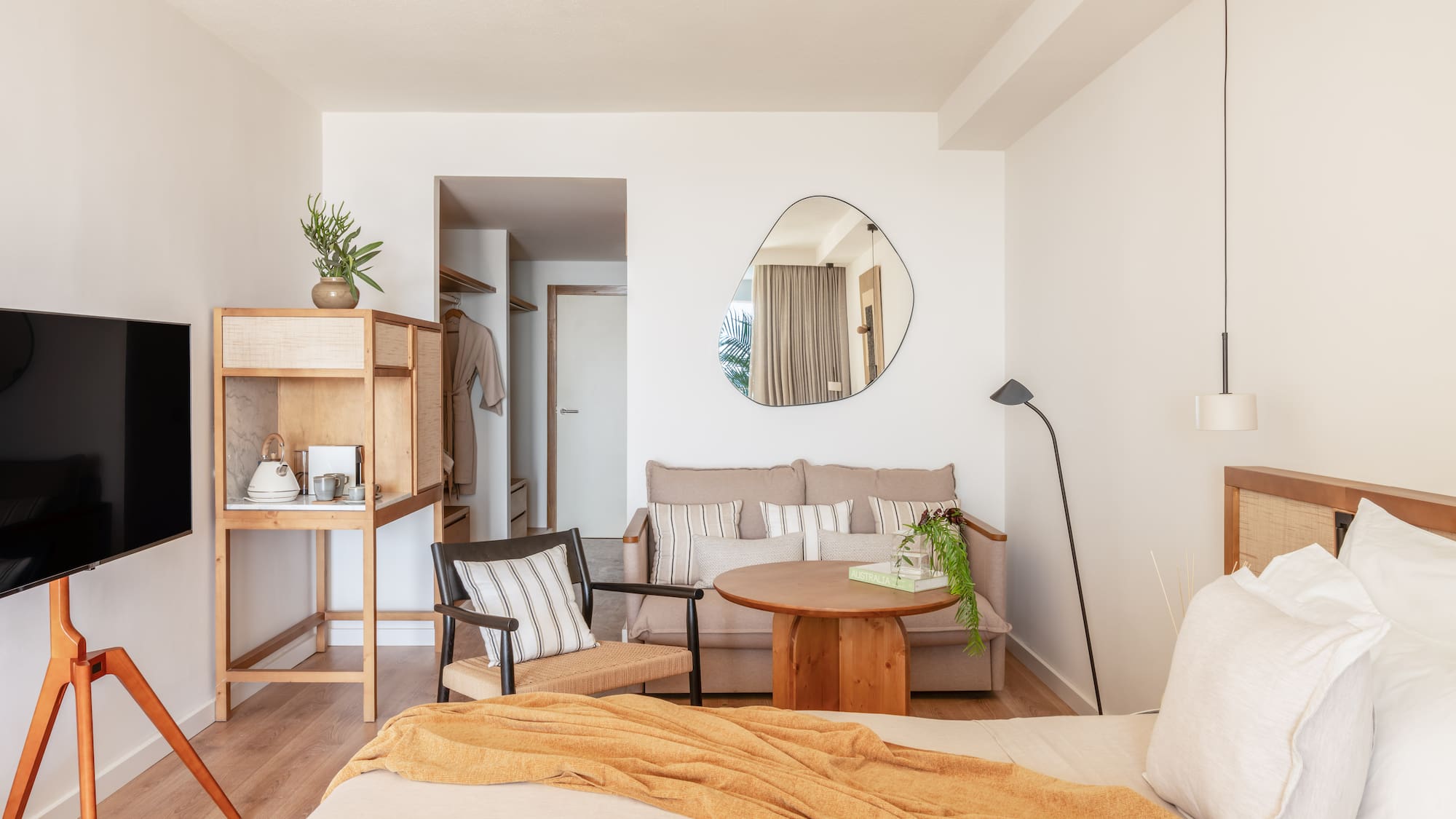 a bedroom with a bed and a couch