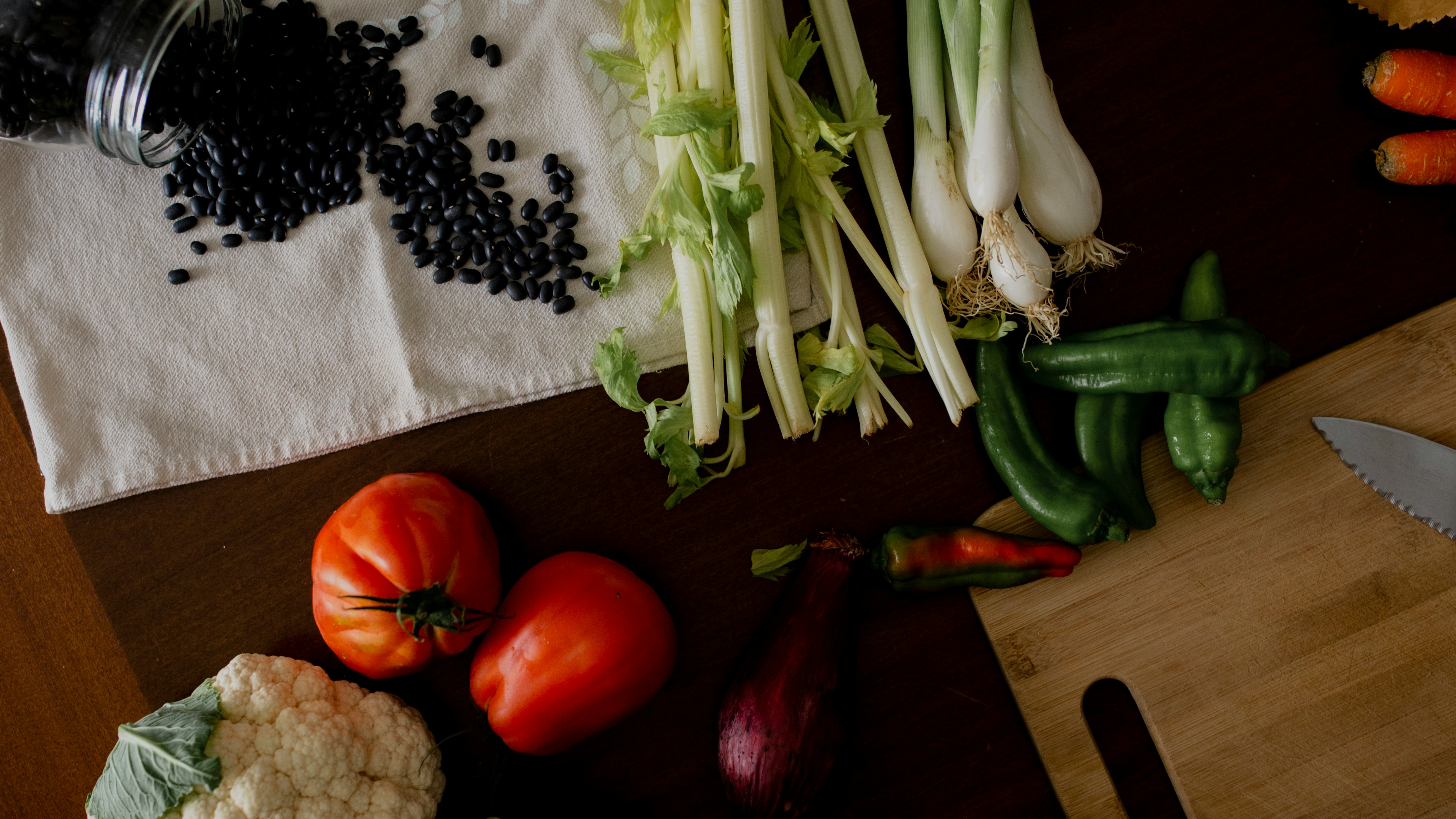 Healthy fresh vegetables, black beans, celery, tomatoes, peppers for cooking.