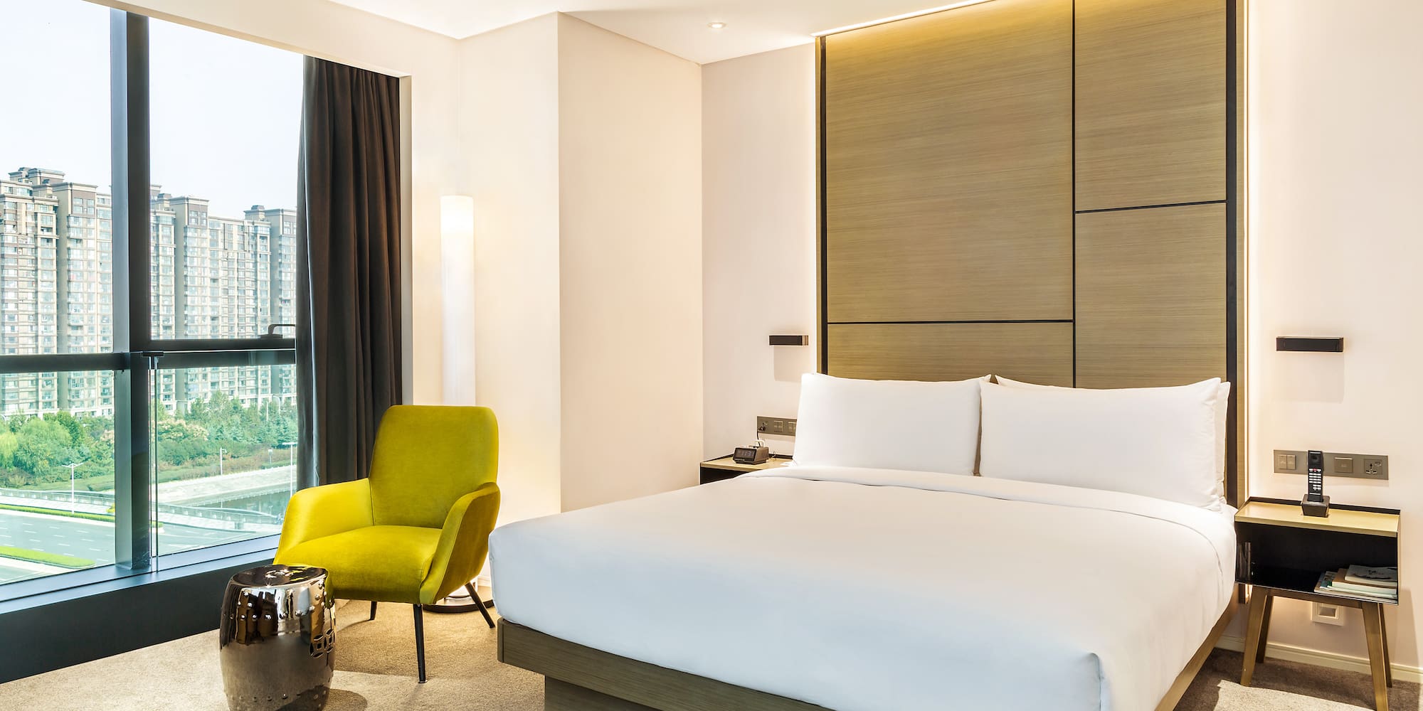 a bedroom with a bed and a chair