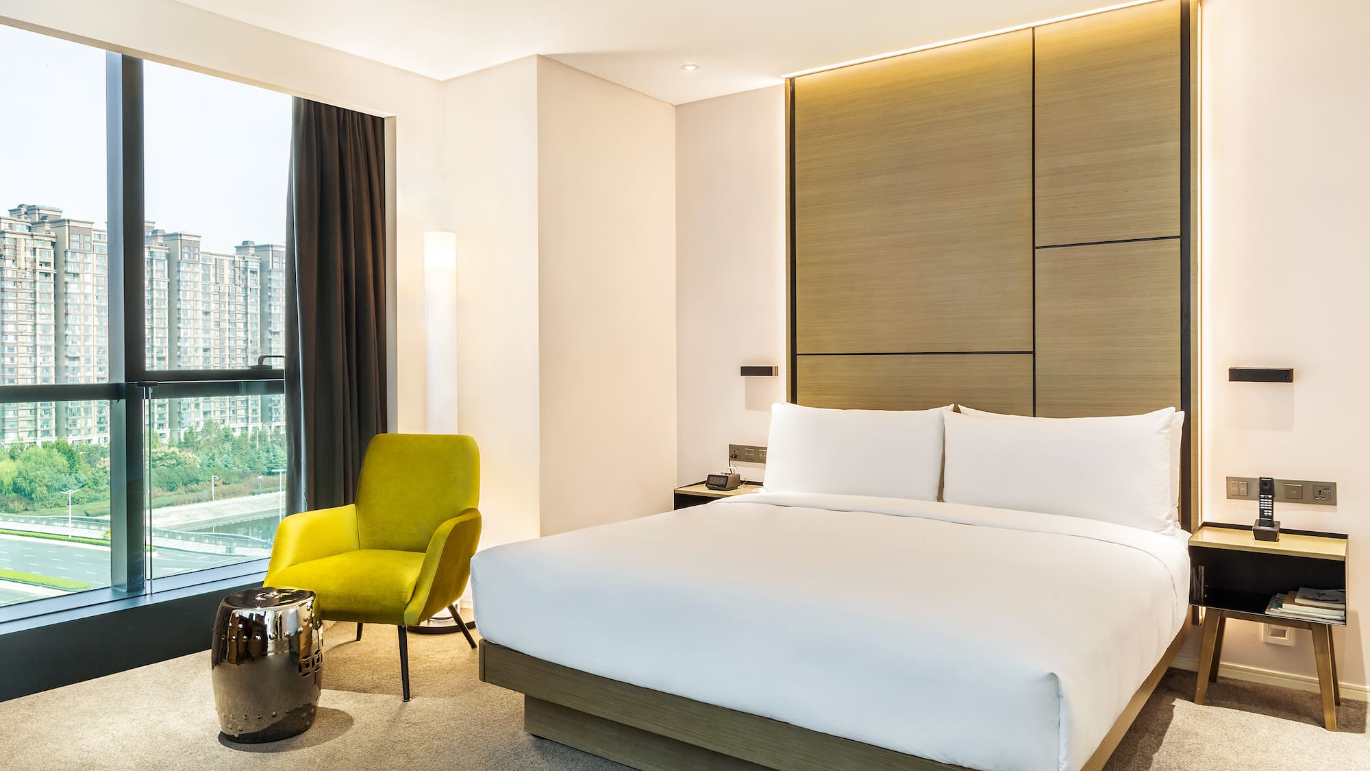 a bedroom with a bed and a chair