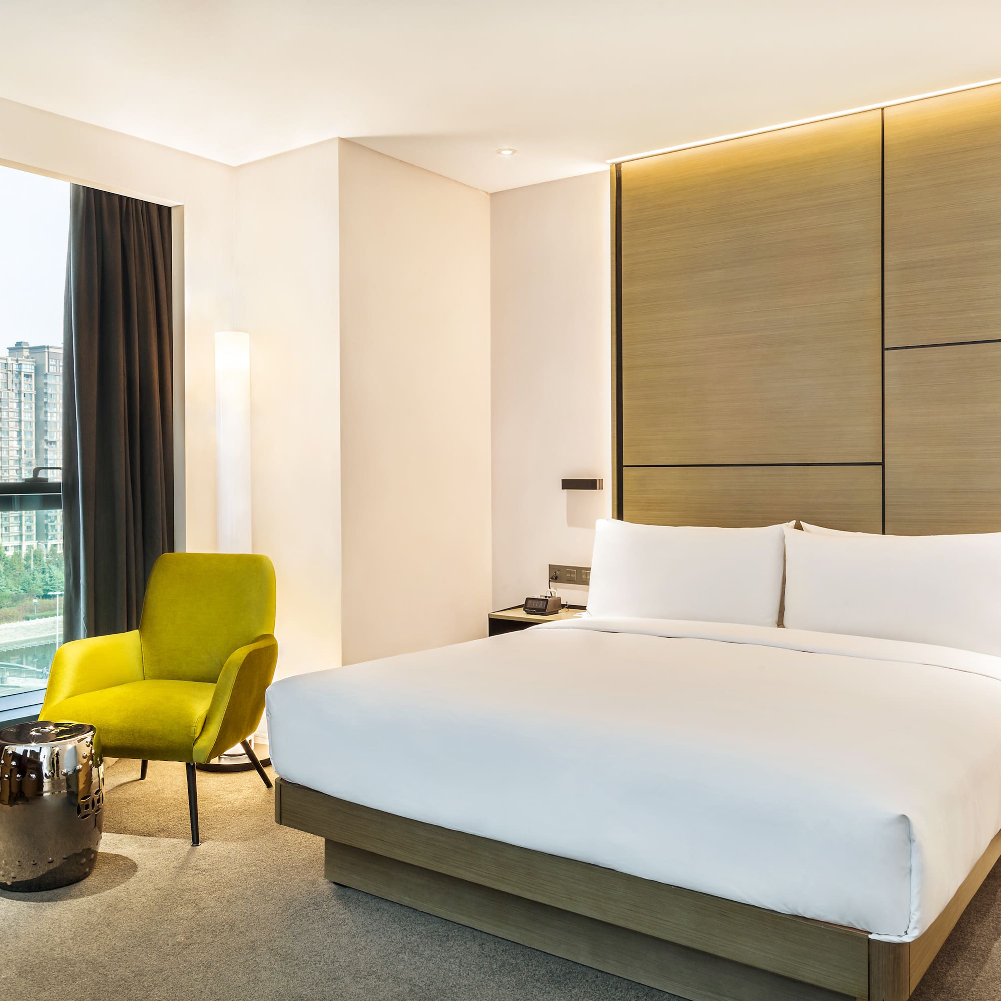 a bedroom with a bed and a chair