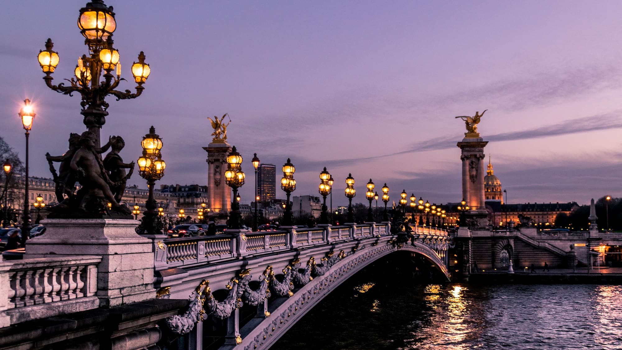 Pont Alexandre III with lights and a body of water